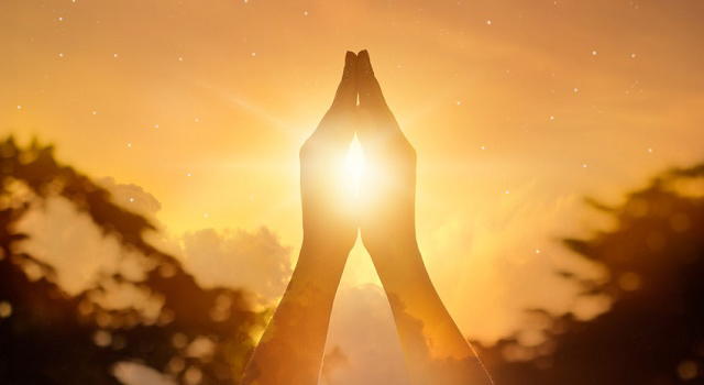 hands-in-sunset-prayer